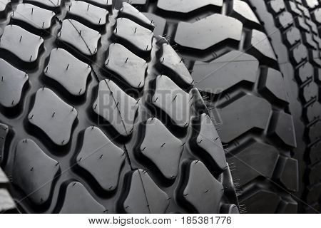 Big truck wheel a black tires closeup