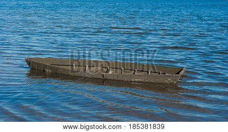 old boat in the middle of the river