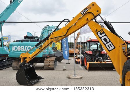 VILNIUS LITHUANIA - APRIL 27: JCB heavy duty equipment vehicle and logo on April 27 2017 in Vilnius Lithuania. JCB corporation is manufacturing equipment for construction and agriculture.