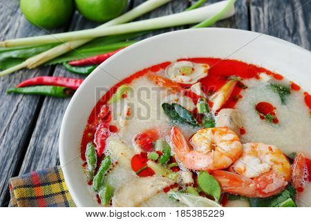 Close up prawn shrimp and lemon grass spicy soup with mushrooms famous Thai food cuisine calling Tom Yum Kung