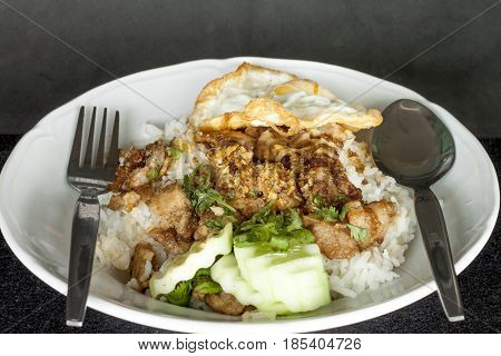 Pork stir-fried with garlic and peppercorns with egg.