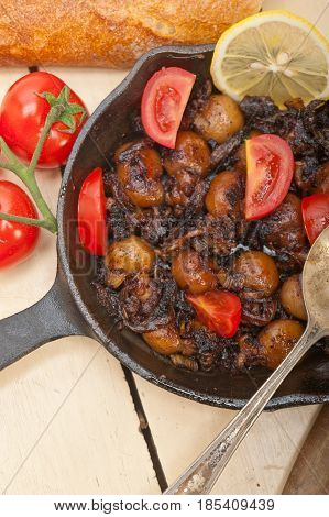 Baby Cuttle Fish Roasted On Iron Skillet