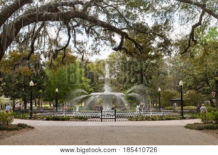 Savannah GA - March 27 2017: Forsyth Park is the largest park in Savannah's historic district and a famous tourist destination. The fountain dates to 1858 and is symbolic of Savannah.