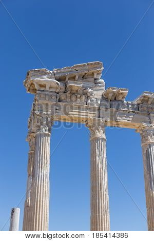 Vertical shot of temple of Apollo against blue sky in ancient ruins of Side in Turkey