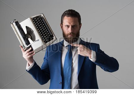 Business Man In Blue Suit And Tie With Typewriter
