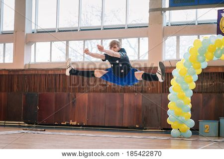Dneprodzerzhinsk Ukraine - November 12 2016: Qualifying round for the cheerleading competition. Cup "Prometheus" young boys cheerleaders perform at the city cheerleading championship