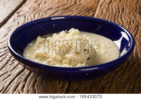 Brazilian Dessert Canjica Our Mungunza Of White Corn In Blue Bowl