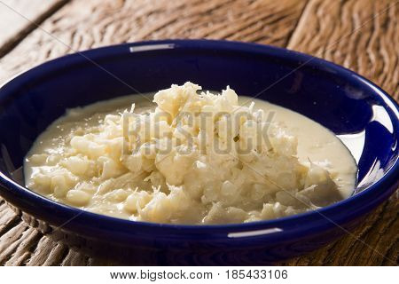 Brazilian Dessert Canjica Our Mungunza Of White Corn In Blue Bowl