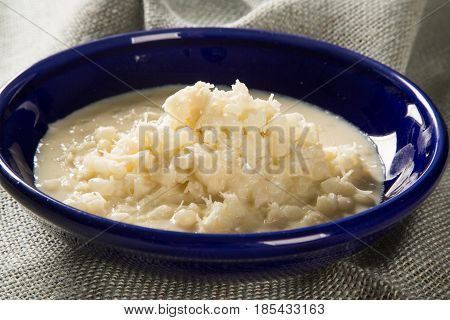 Brazilian Dessert Canjica Our Mungunza Of White Corn In Blue Bowl