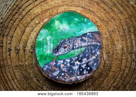 Painted Forest Animal On A Cut Piece Of Wood. Beautiful Natural Paint Colors. Background Of Brown Wo