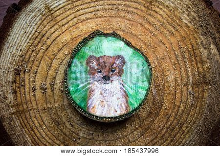 Painted Forest Animal On A Cut Piece Of Wood. Beautiful Natural Paint Colors. Background Of Brown Wo
