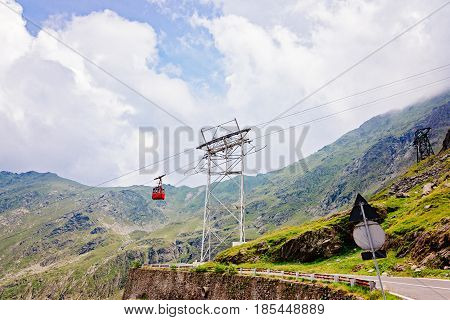 Red Cable Car Over The Transfagarasan Mountain Road