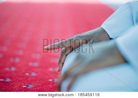African Muslim Man Making Traditional Praying To God While Wearing A Traditional Cap Dishdasha