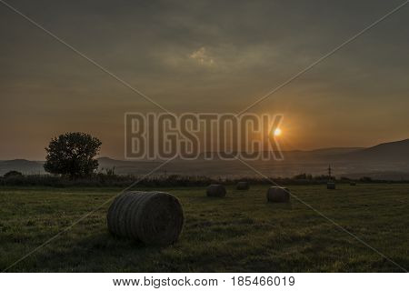 Orange sunset near Milada lake in north Bohemia