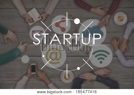 Teamwork startup concept - top view of six people. Startup Business Concept on wooden table. Blur.