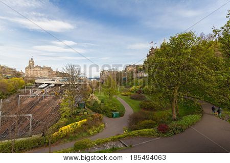 Edinburgh Scotland Skyline with Princess Street Gardens Waverly Train Station in sight on a beautiful spring afternoon