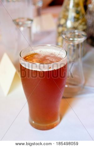 Craft beer ipa in a pint glass at a wedding reception 