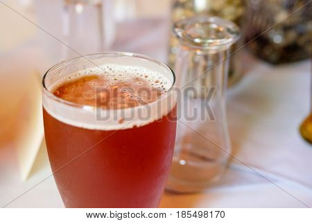 Craft beer ipa in a pint glass at a wedding reception  