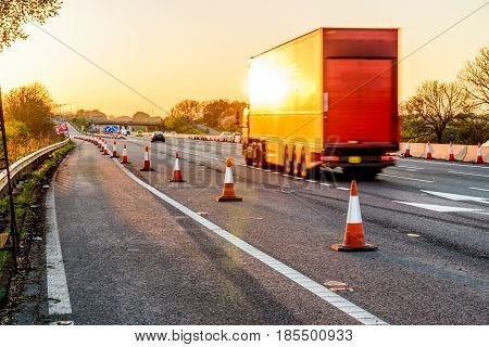 Evening view UK Motorway Services Roadworks Cones.