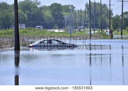 Stranded Car On A Flooded Road