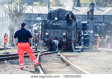 BOCHUM , GERMANY - APRIL 18 2015 : Worker observing the activities at the railway station