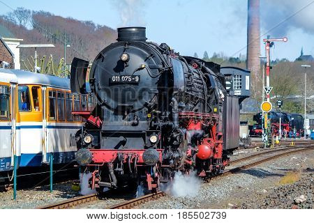 BOCHUM , GERMANY - APRIL 18 2015 : Steam train passing the station in Bochum-Dahlhausen