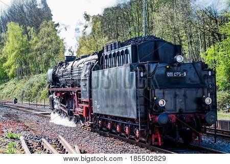 BOCHUM , GERMANY - APRIL 18 2015 : Steam train passing the station in Bochum-Dahlhausen