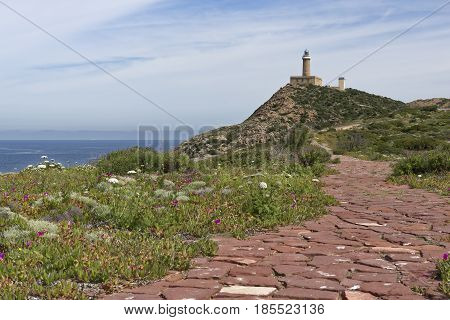 Capo Sandalo Lighthouse on the Westernmost point os St Pietro Island. Southwestern corner of Sardinia Italy