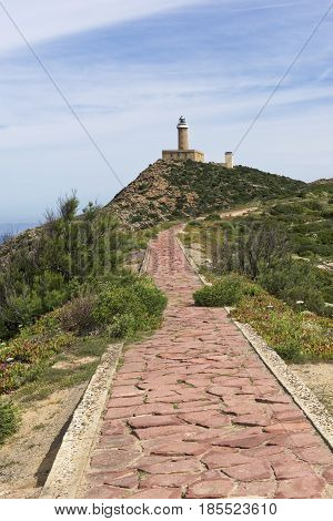 Capo Sandalo Lighthouse on the Westernmost point os St Pietro Island. Southwestern corner of Sardinia Italy