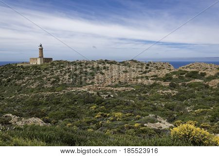 Capo Sandalo Lighthouse on the Westernmost point os St Pietro Island. Southwestern corner of Sardinia Italy