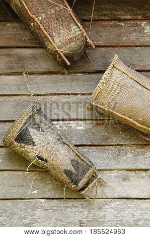 Traditional Dayak tribal culture from Borneo island in Indonesia. Baskets woven by hand from palm leaves for transporting goods on an island