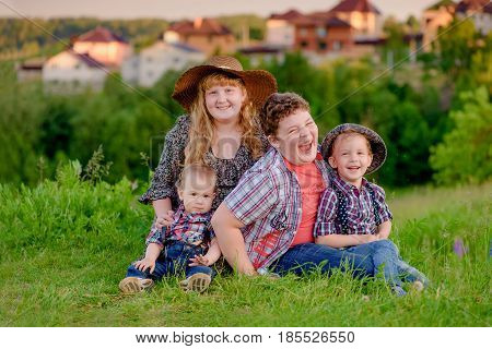 funny sibling on the background of the village