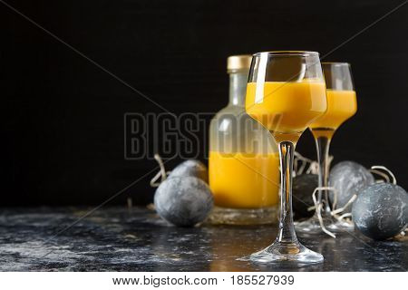 Traditional Italian Yellow Egg Liquor, Bombardino. Dark Backgrou