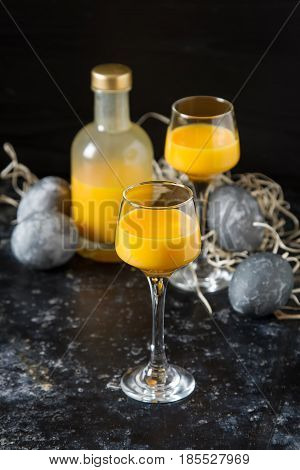 Traditional Italian Yellow Egg Liquor, Bombardino. Dark Backgrou