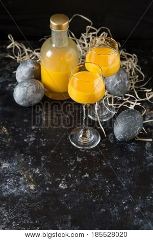 Traditional Italian Yellow Egg Liquor, Bombardino. Dark Backgrou