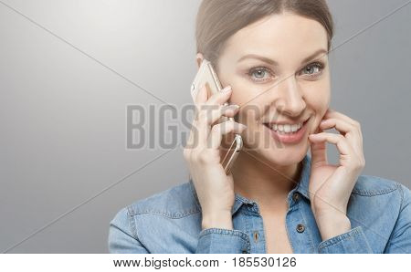 Closeup Photo Of Attractive Young Woman Isolated On Grey Background Touching Her Cheek With Fingers
