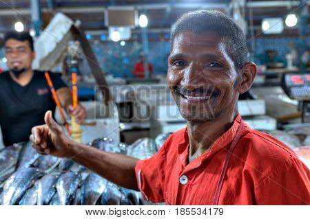 Bandar Abbas Hormozgan Province Iran - 15 april 2017: A Persian handyman at a fish market smiles a close-up portrait.