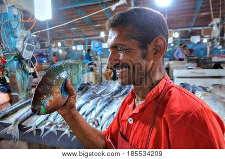 Bandar Abbas Hormozgan Province Iran - 15 april 2017: Close-up portrait of a cheerful Persian worker in the fish market.