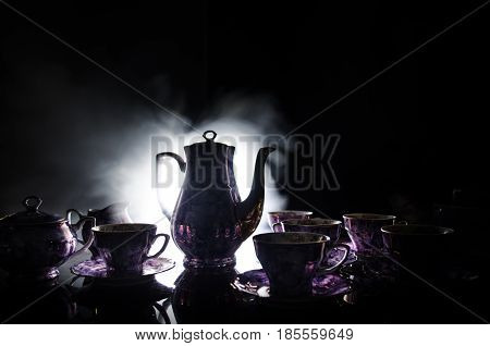Food Background Tea And Coffee Theme. Old Vintage Ceramic Tea Or Coffee Pot With Cups Jug And Sugar