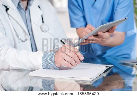 Doctors Having A Meeting In Medical Office
