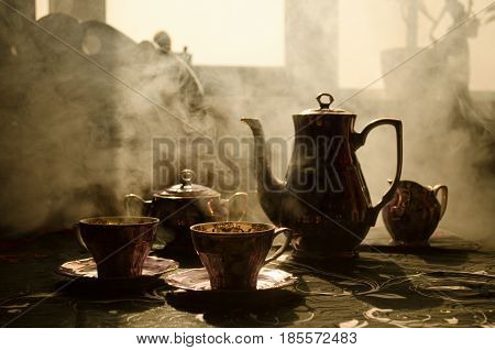 Food Background Tea And Coffee Theme. Old Vintage Ceramic Tea Or Coffee Pot With Cups Jug And Sugar