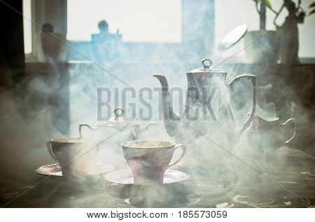 Food Background Tea And Coffee Theme. Old Vintage Ceramic Tea Or Coffee Pot With Cups Jug And Sugar