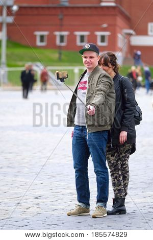 Red Square, Moscow, Russia - May, 7, 2017: couple makes selfie on Red Square in Moscow