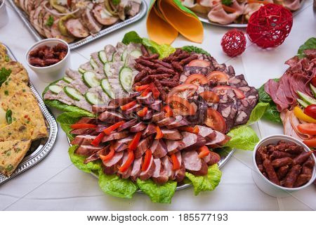 A Dish With Cheese, Salami, Sausage And Green On The Raut Table For The Celebration
