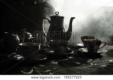 Food Background Tea And Coffee Theme. Old Vintage Ceramic Tea Or Coffee Pot With Cups Jug And Sugar