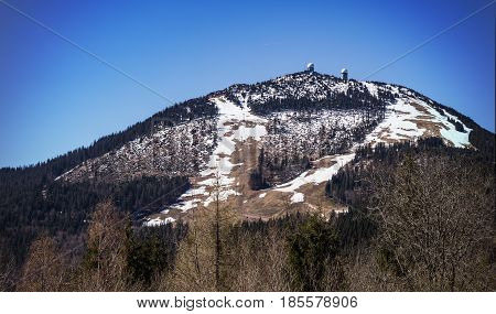 Spring Day snow on the slopes of Grosser Arber Bavaria Germany. Summit of Grosser Arber in Bayerischer Wald in Germany