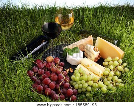 Cheese Platter And Wine With Different Cheese And Grapes