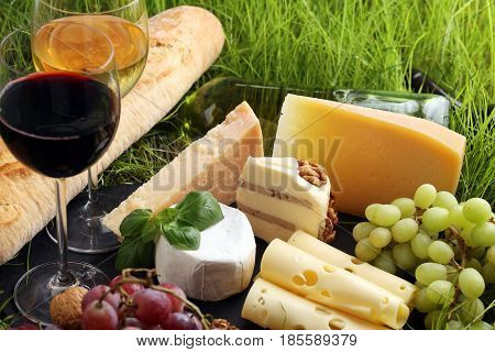 Cheese Platter And Wine With Different Cheese And Grapes