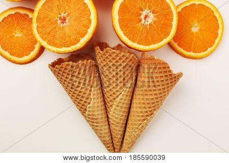 Cones And Colorful ,orange Slice , Setup On White Background . Summer And Sweet Menu Concept Flat La