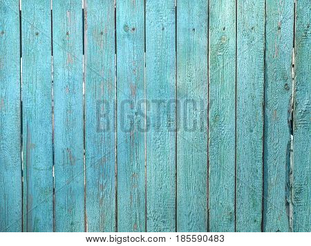 Background from a wooden fence of blue color
